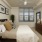 a bedroom with a bed and a fan