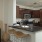 a kitchen with a bar and stools