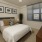 a bedroom with a bed and a table