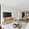 living room with a couch, coffee table, and tv