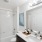 bathroom with bathtub sink and large mirror