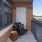 a patio with a chair and a basket on it