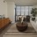 a living room with a large bowl of flowers